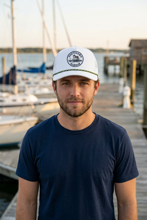 Model wearing the Southern Harbor Bay Collection hat at a coastal marina